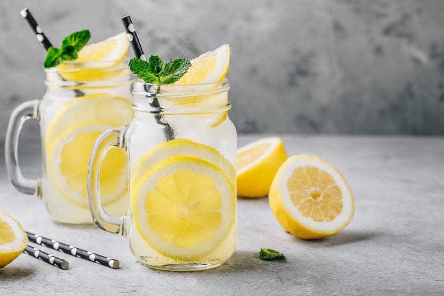 Two mason jars filled with water and lemon slices.