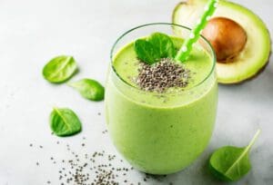 A green smoothie with spinach, avocado and chia seeds.