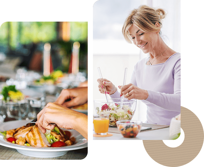 A woman is eating at the table and another person is holding a spoon.