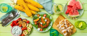 A table with plates of food and drinks on it.