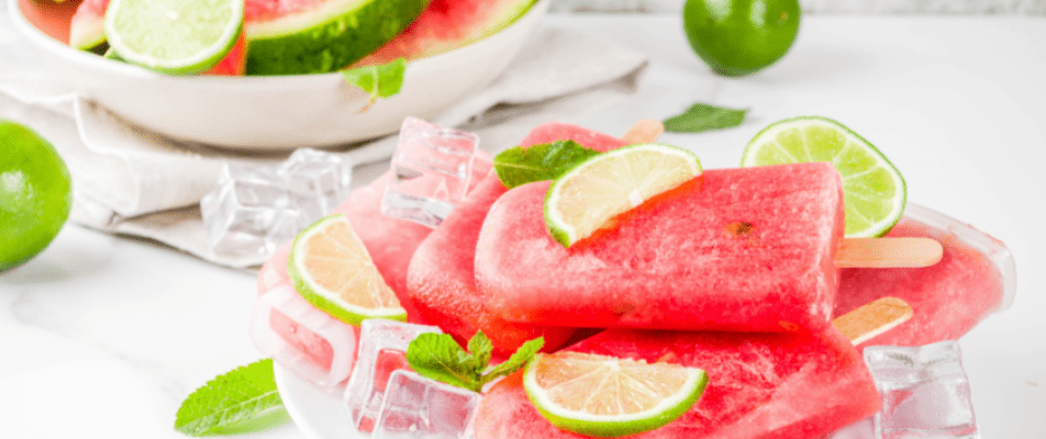 A close up of watermelon slices on ice