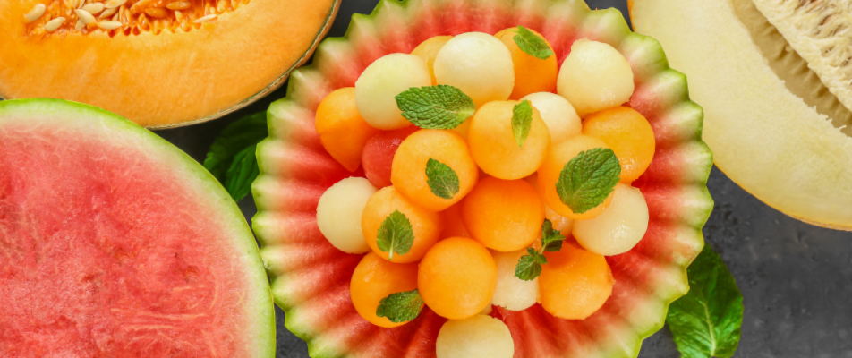 A plate of melon and other fruit is shown.