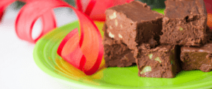 A piece of chocolate cake on a green plate.