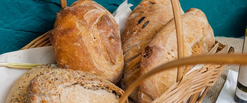 A close up of several different types of bread.