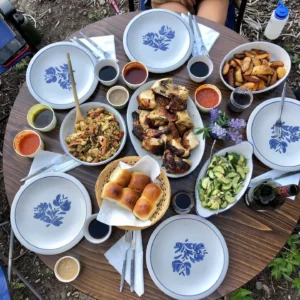 A table full of food with plates and bowls.