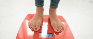 A person standing on a scale with their feet