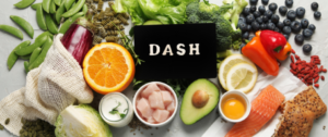 A table topped with fruits and vegetables next to dash.
