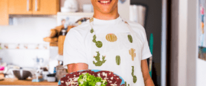 A man holding a plate of food in his hands.