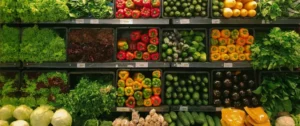 A display case filled with lots of different vegetables.